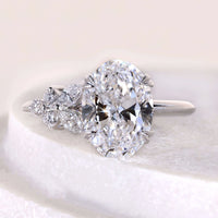 Oval Cut Diamond Ring With Side Stone Round & Marquise