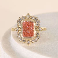 Halo Style Radiant Cut Pink Diamond Ring With Marquise Outline