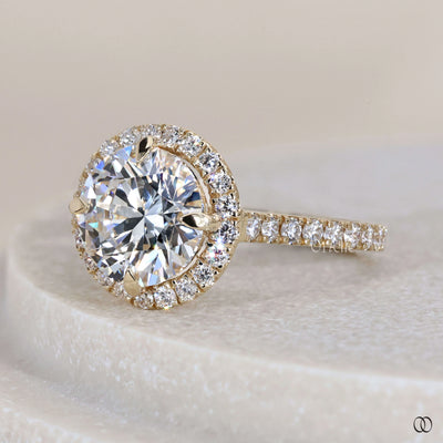 Unique engagement ring featuring round diamond halo design

