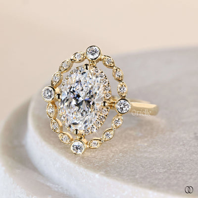 Unique engagement ring featuring oval cut diamond
