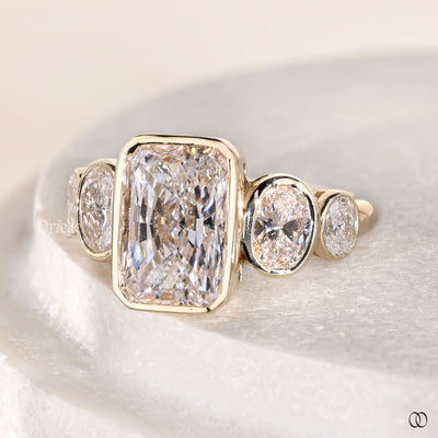 side stone ring radiant cut yellow gold ring
