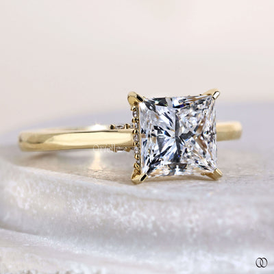 Unique princess cut diamond ring with cathedral setting
