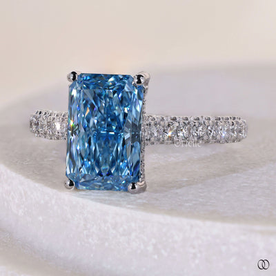 Handmade radiant cut diamond ring with hidden halo engagement design
