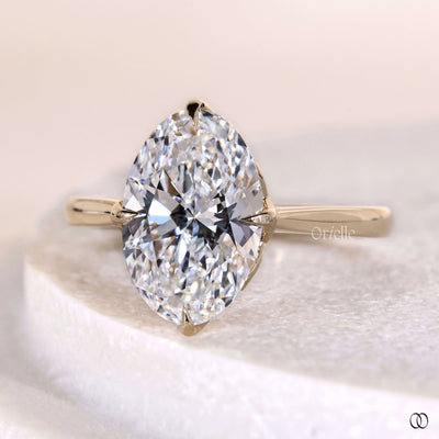 Handmade oval solitaire diamond ring with claw prong setting
