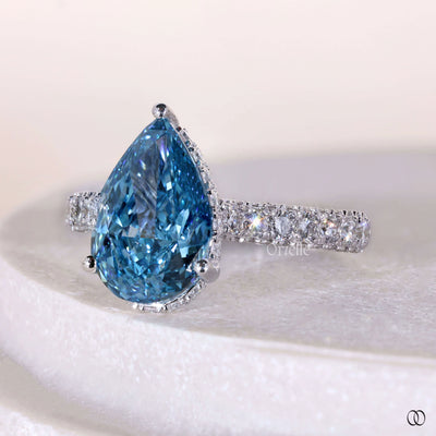 Handmade pear shaped diamond engagement ring with round prongs setting
