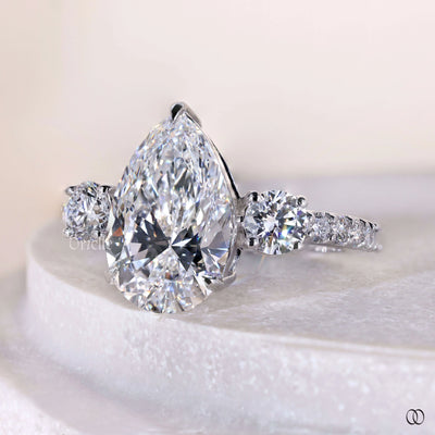 Handmade pear cut diamond engagement ring with unique setting
