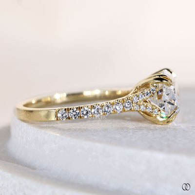 East west oval engagement ring with pave diamond band
