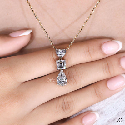 unique heart pendant with three diamond prong setting
