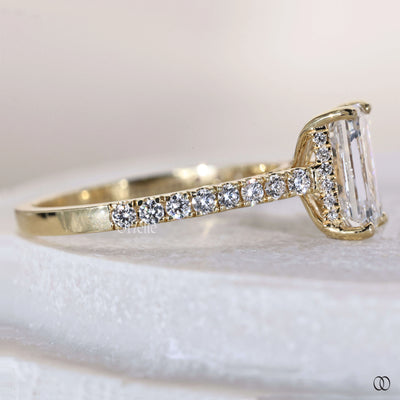 4 prong ring securing emerald cut diamond
