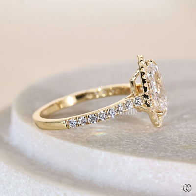 Pear engagement ring set in classic prong setting ring
