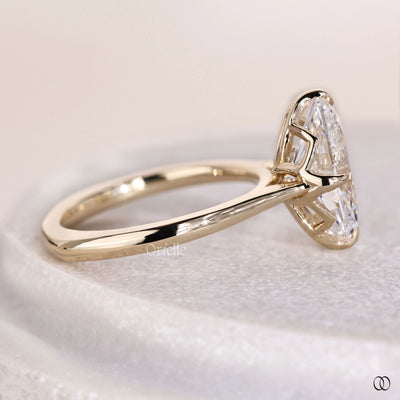 Oval cut diamond ring with tulip setting and cathedral style band
