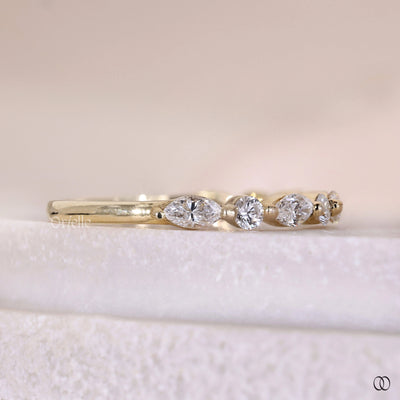 designer marquise and round diamond wedding band in gold
