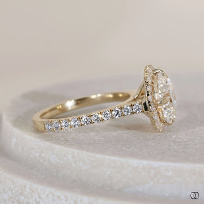 Cathedral setting ring with round diamond centerpiece

