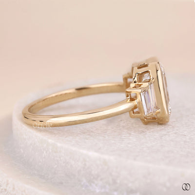 yellow gold engagement ring emerald cut diamond
