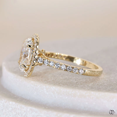 Handmade ring crafted as oval halo engagement ring
