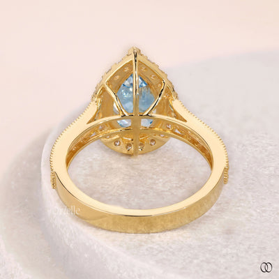 fancy vivid blue diamond pear halo ring
