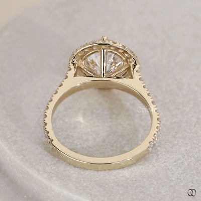 Round cut engagement ring secured by claw prong setting
