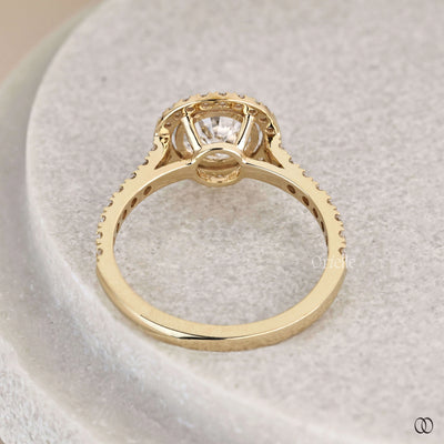 Round brilliant engagement ring framed by halo diamond ring
