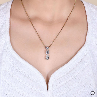 designer heart pendant with princess and pear diamonds
