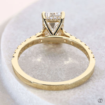 Emerald cut ring with hidden halo diamond detail
