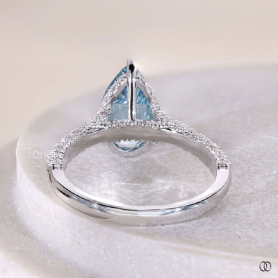 Unique pear shaped diamond engagement ring with hidden halo style
