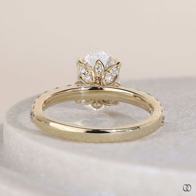 Oval engagement ring with hidden side stone detail
