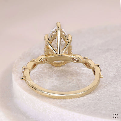 marquise side stone ring pear diamond setting
