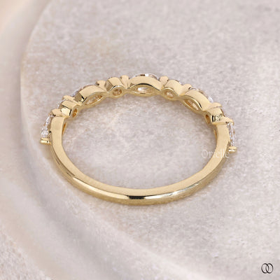 elegant yellow gold marquise and round diamond band
