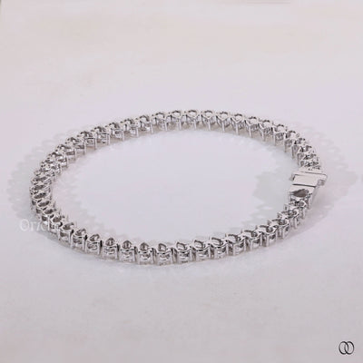 white gold pear diamond tennis bracelet design

