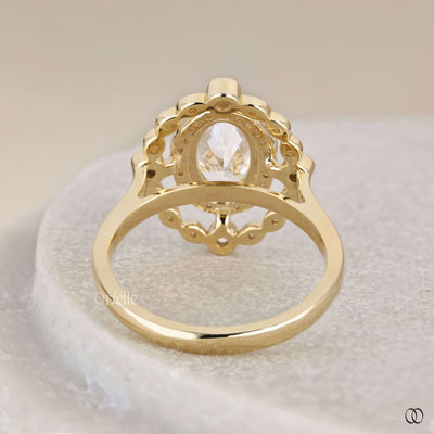Oval engagement ring with round side halo setting

