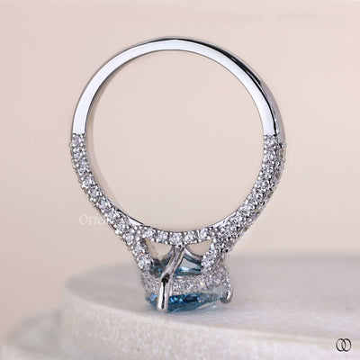 Lab grown pear shaped diamond solitaire ring with round prongs
