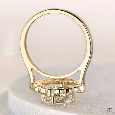 Yellow gold ring with round cut diamond centerpiece
