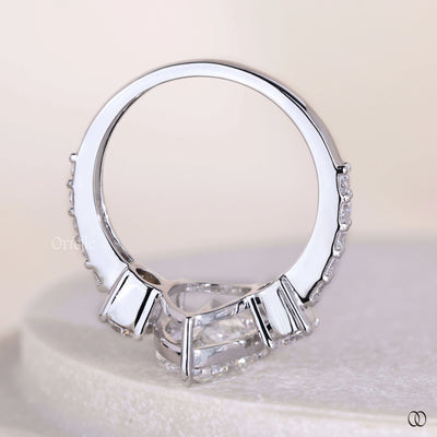 Lab grown pear cut diamond engagement ring with white gold band

