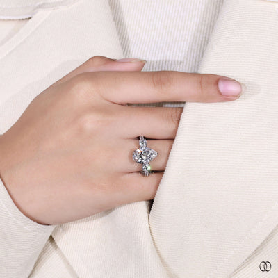 Lab grown pear cut diamond ring with claw prong engagement setting
