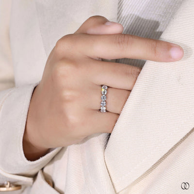 handmade round diamond bezel set wedding band in gold
