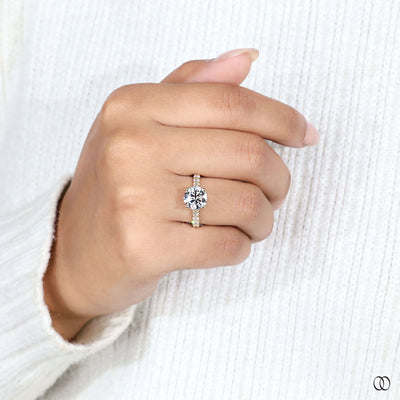 Yellow gold ring featuring round diamond ring

