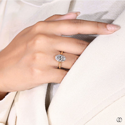 Yellow gold oval cut diamond engagement ring with unique setting
