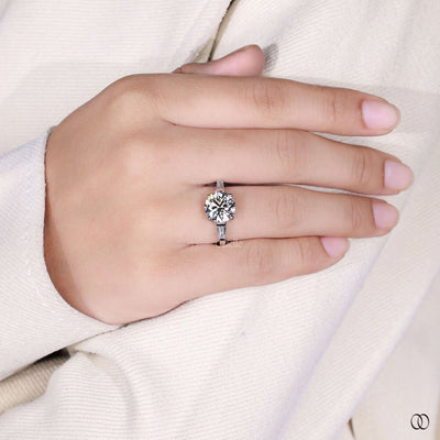 white gold ring round cut three stone engagement ring
