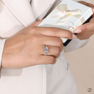 Yellow gold engagement ring with east west oval
