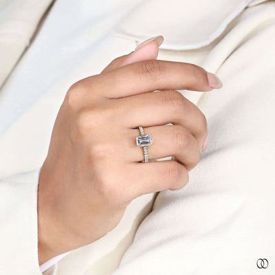 Yellow gold engagement ring with emerald cut center
