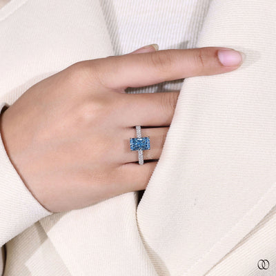 Unique radiant cut diamond engagement ring with hidden halo design
