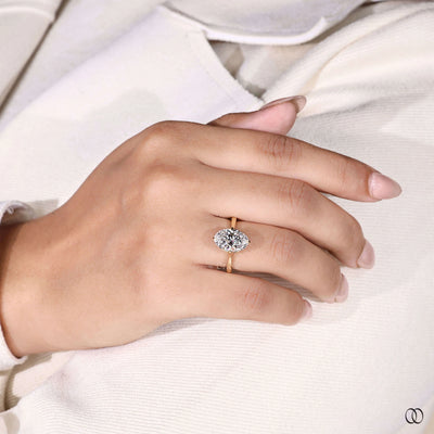 Lab grown oval cut diamond engagement ring in unique gold setting
