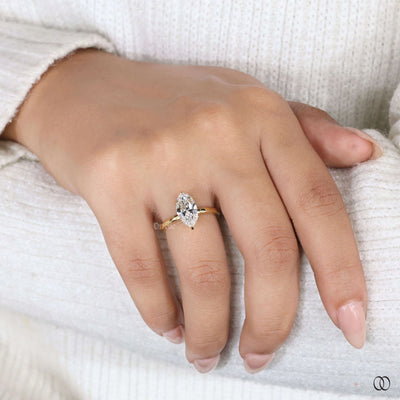 Marquise engagement ring with hidden diamond detail
