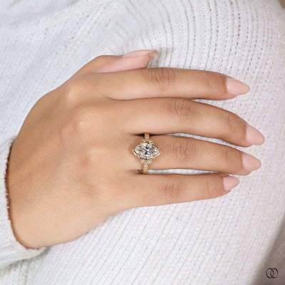 Yellow gold engagement ring with marquise centerpiece
