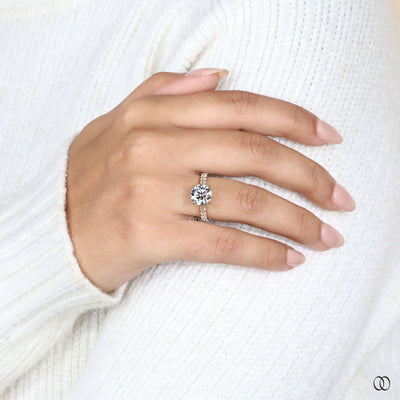 Hidden halo engagement ring beneath round diamond
