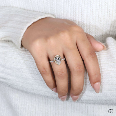 Handmade ring designed as a pear cut halo diamond ring
