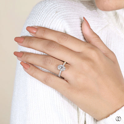 Yellow gold engagement ring with oval diamond centerpiece
