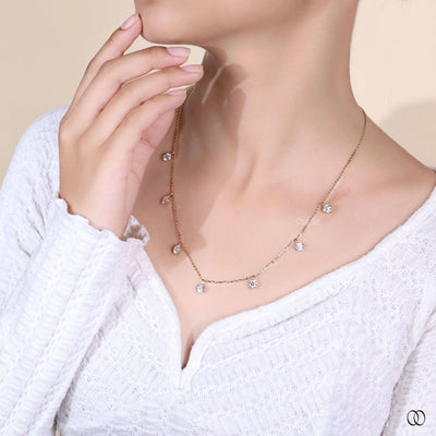 yellow gold round diamond necklace 7 stone style

