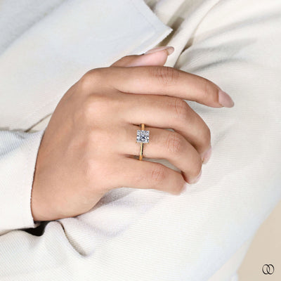 Cathedral engagement ring supporting princess cut diamond
