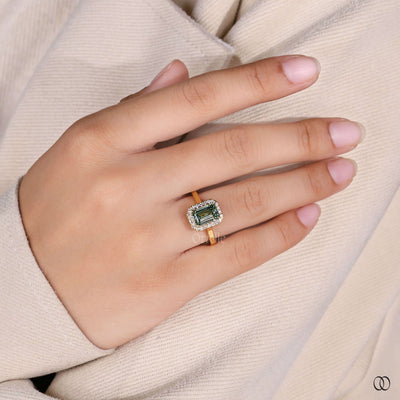 halo diamond ring emerald green gold design

